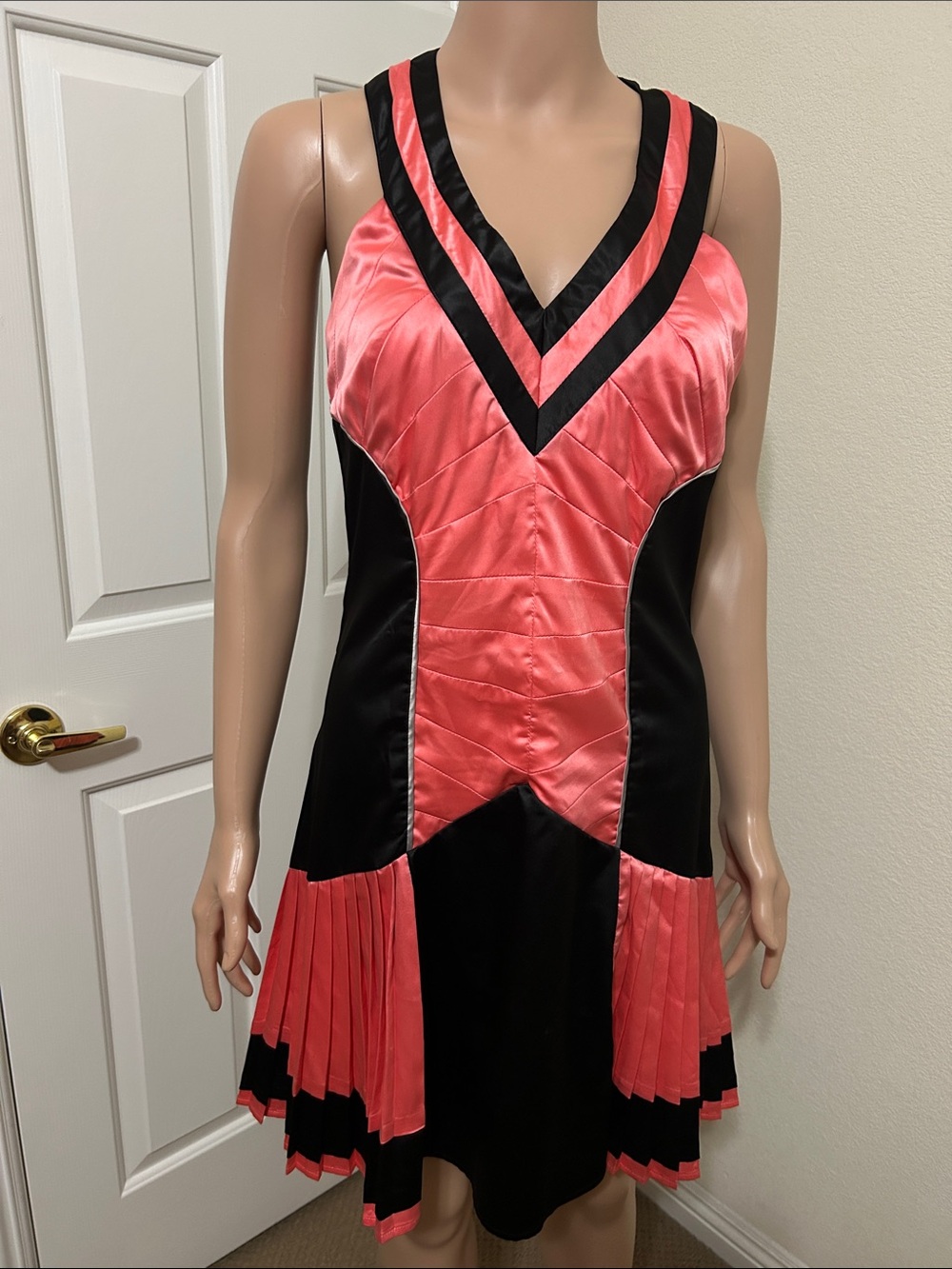 Lovey Dovey Women’s Size Medium Coral and Black V-Neck Pleated Dress.
